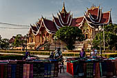 Vientiane, Laos - Pha That Luang, Outside the walled area are souvenir shops and food stalls.